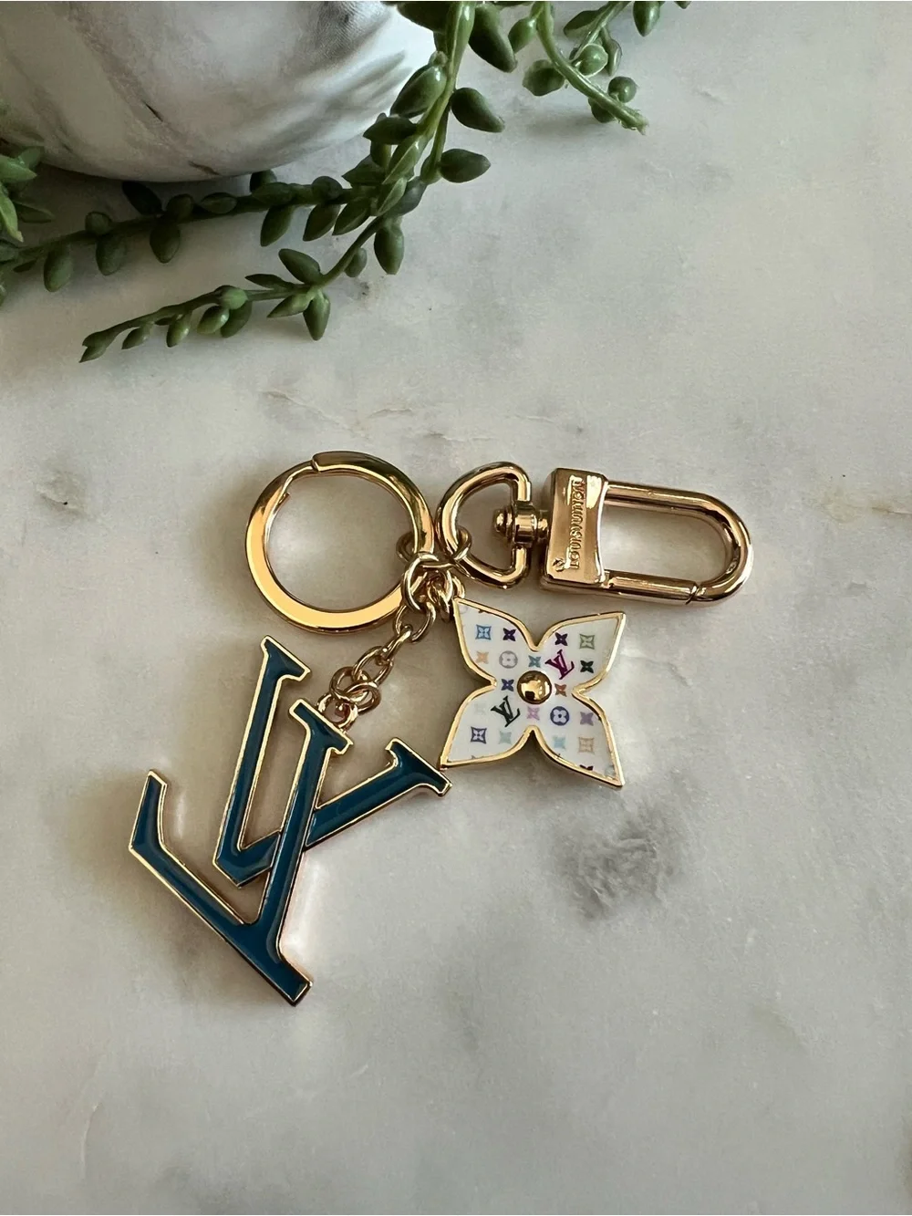 Louis Vuitton Gold-Tone Key Charm with Blue LV and White Multicolor Flower